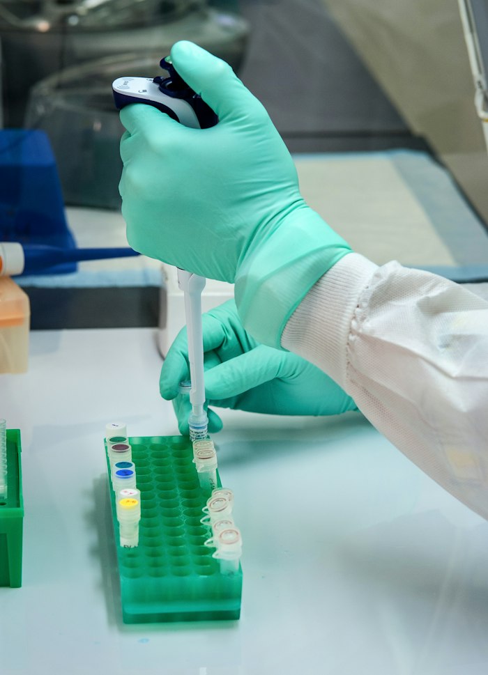 Sterilization indicator being handled in a laboratory setting